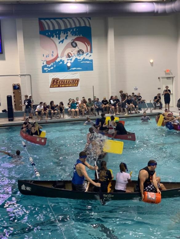 The Homecoming Battleship competition draws many students to the Rec Center pool. The competition involved dumping water into other teams' kayaks to try to sink them. - Contributor / Rebecca Fox
