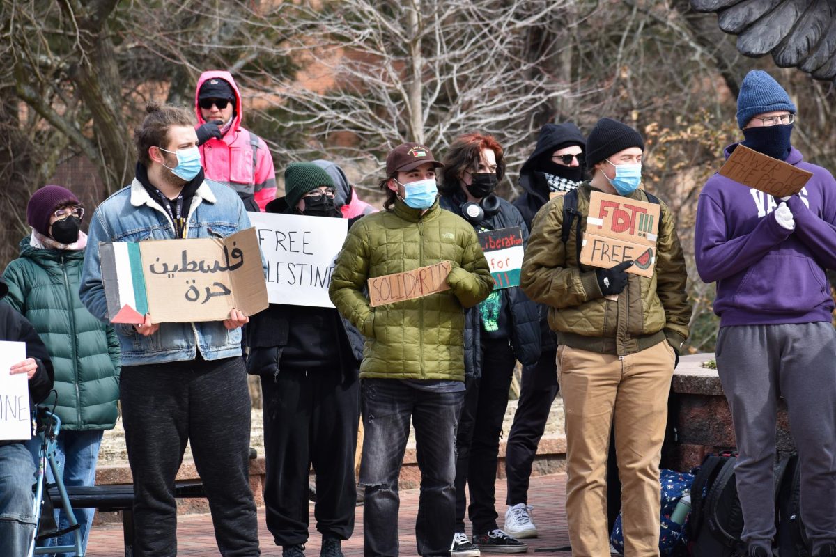 Students hold signs protesting SJP's discontinuation in front of the owl statue on campus, Glassboro, NJ. Tuesday, February 18, 2025. - Staff Photographer / Owen Miller