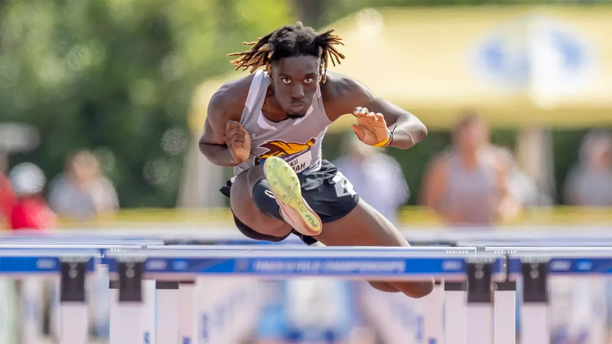 Kwaku Nkrumah competes in the hurdles. Nkruhmah placed first in the 110-meter hurdles. - Photo via Rowan Athletics